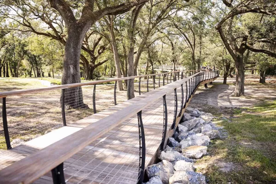 Wooden walkway in forest in Bonnet Springs Park, Lakeland, Florida.